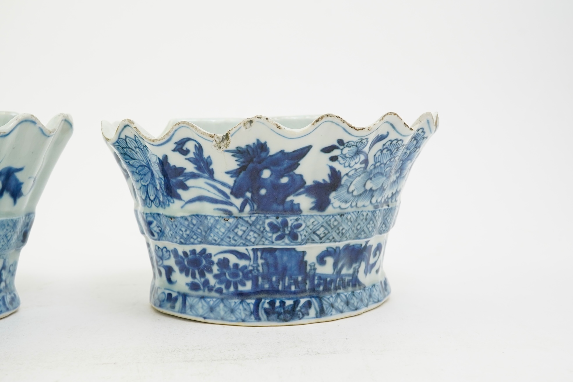 A pair of unusual Chinese export blue and white bough pots, after a Delft model, Qianlong period